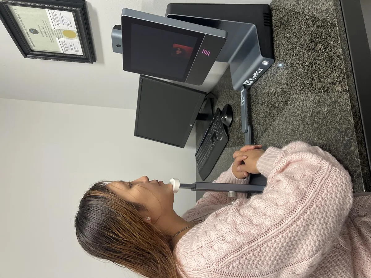 Patient using the EyeBOX eye-tracking device at Saint Paul Hyperbaric Oxygen Center